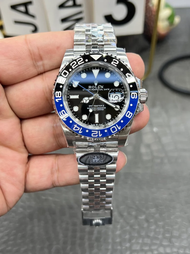 Front view of a GMT-style watch showing dial layout, bezel markings, and date window