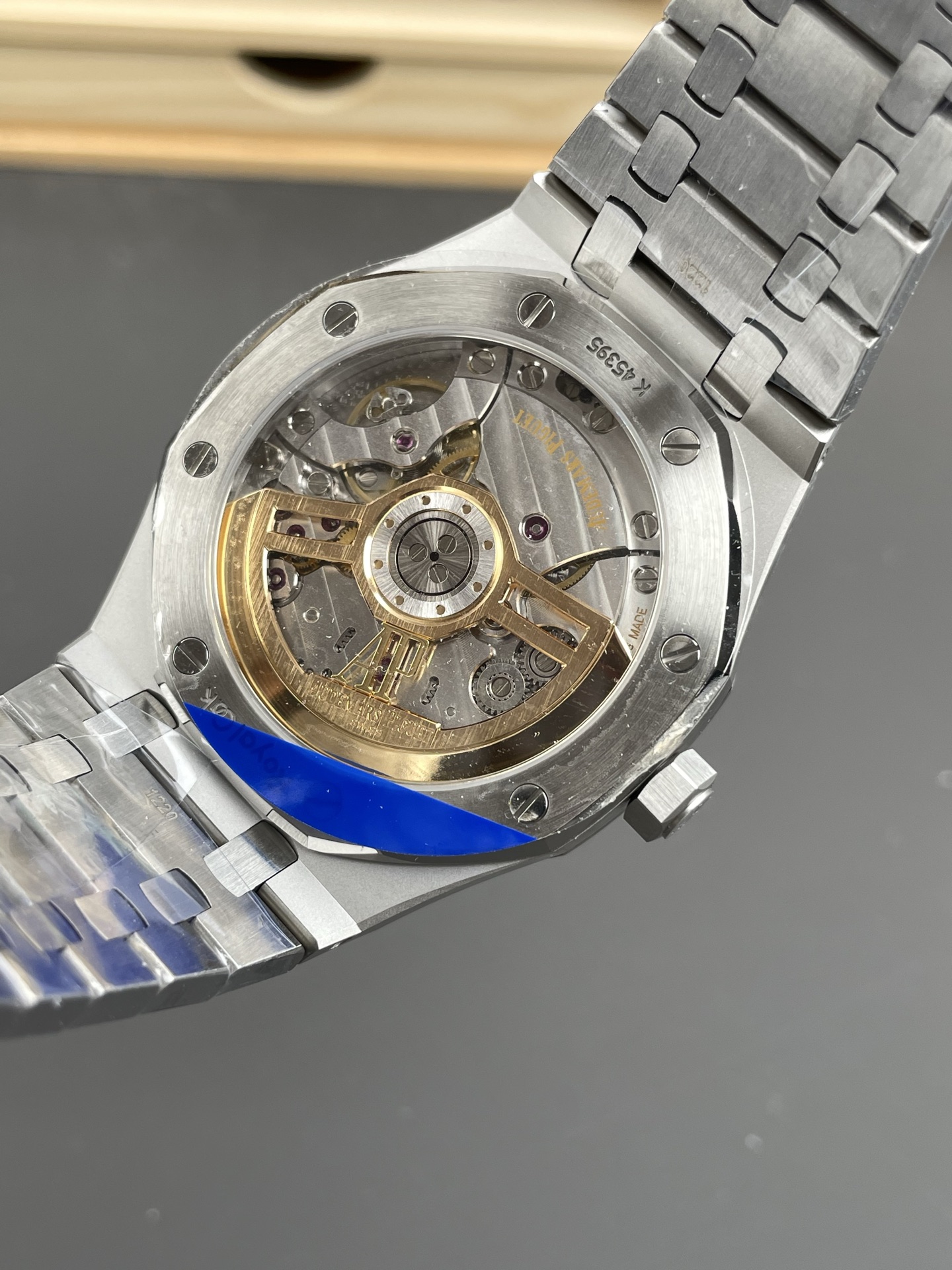 Transparent caseback displaying APS 1:1 clone Caliber 4302 movement architecture