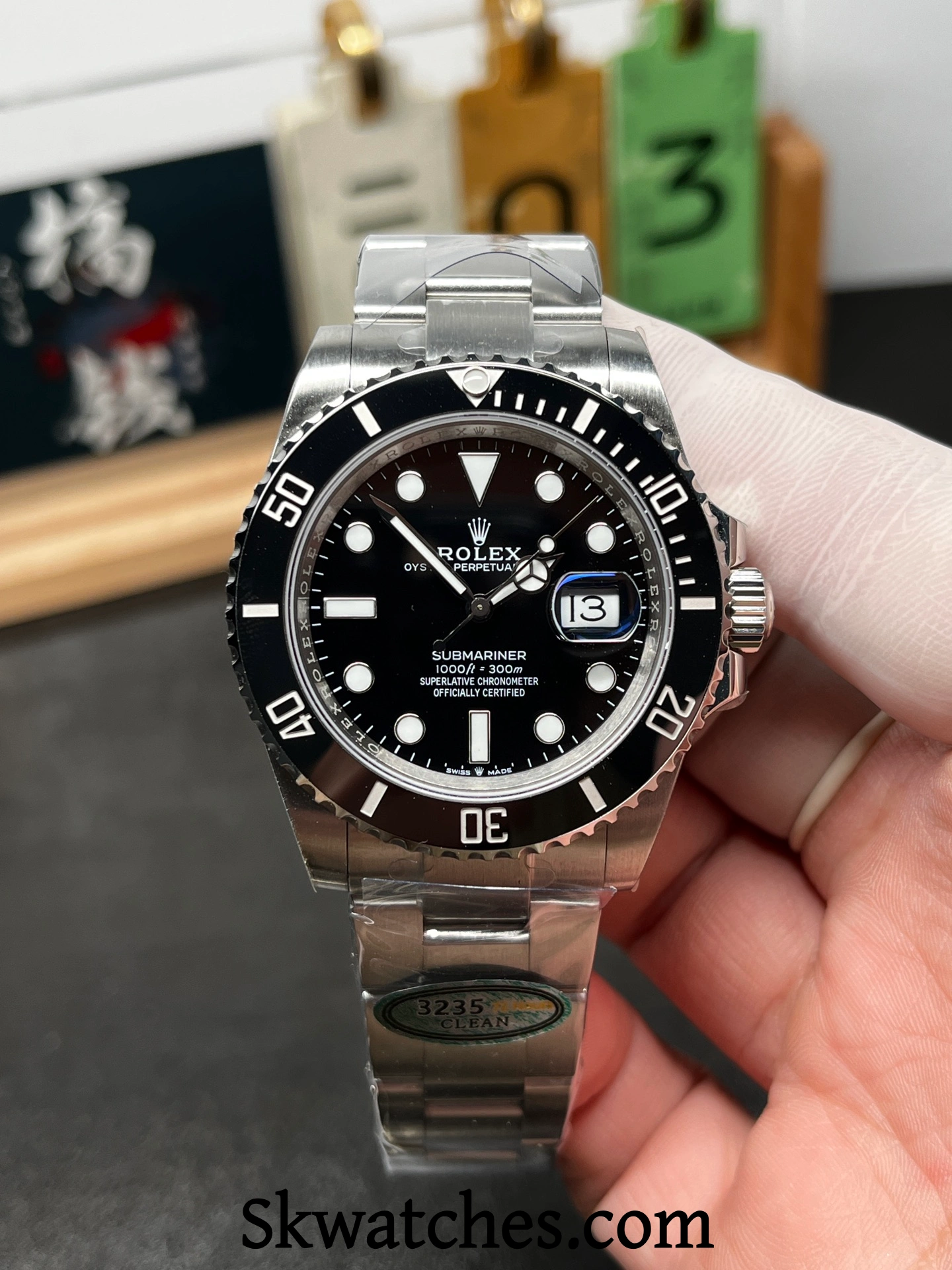 Black dial details on a high quality Rolex Submariner replica, showing marker alignment, hands finishing, and date window
