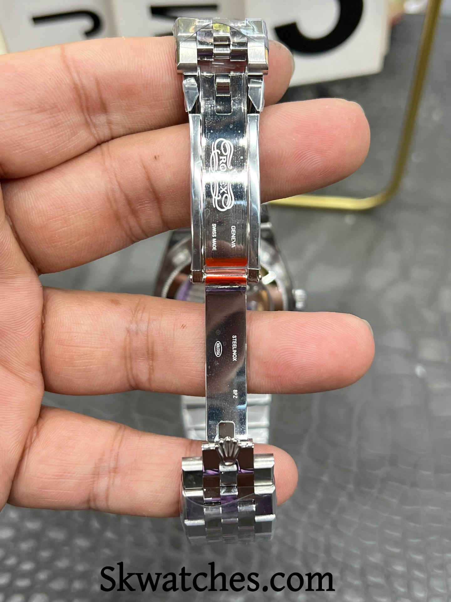 Rolex Land Dweller replica clasp engraving detail