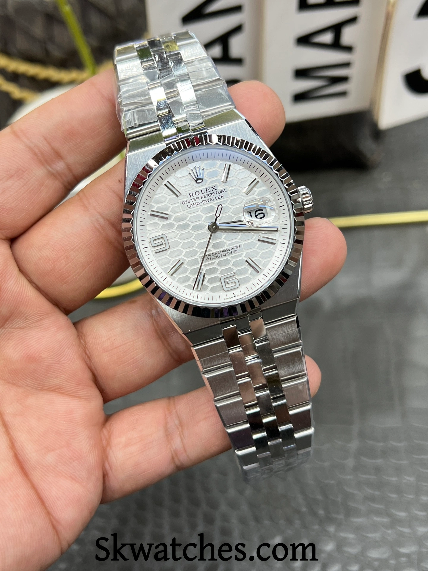 Rolex Land Dweller replica fluted bezel angle detail