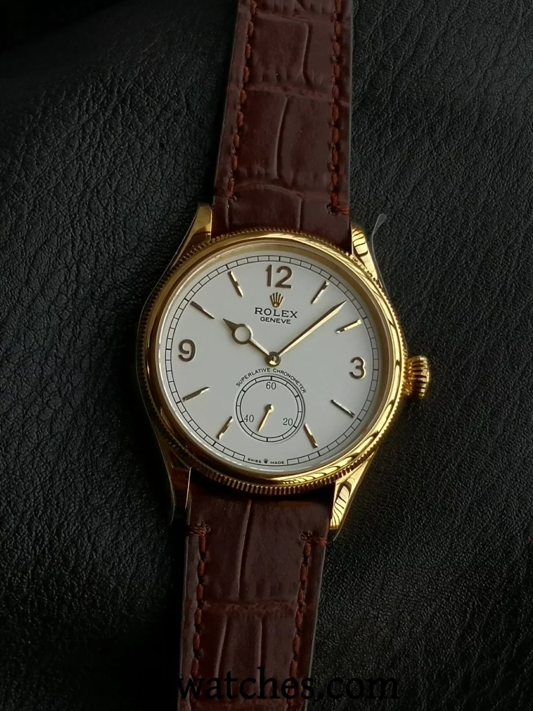 ES Factory Replica Rolex 1908 watch with gold case and brown leather strap, close-up of dial showing hour, minute, and small seconds hands