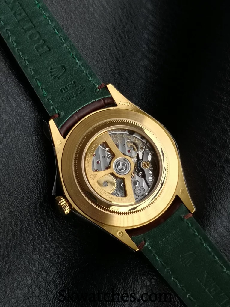 Back view of ES Factory Replica Rolex 1908 showing transparent caseback, 7140 1:1 clone movement, and green inner strap lining